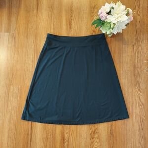 Indigo dark green woman skirt. Size L. Stretch. Comfy. All seasons. Rayon/Spande